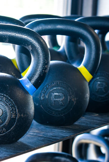 Row of kettlebells at CrossFit Alaska.