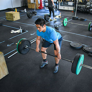 Male member deadlifts at CrossFit Alaska.
