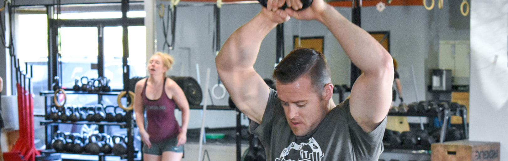 CrossFit class performs kettlebell swings at CrossFit Alaska.