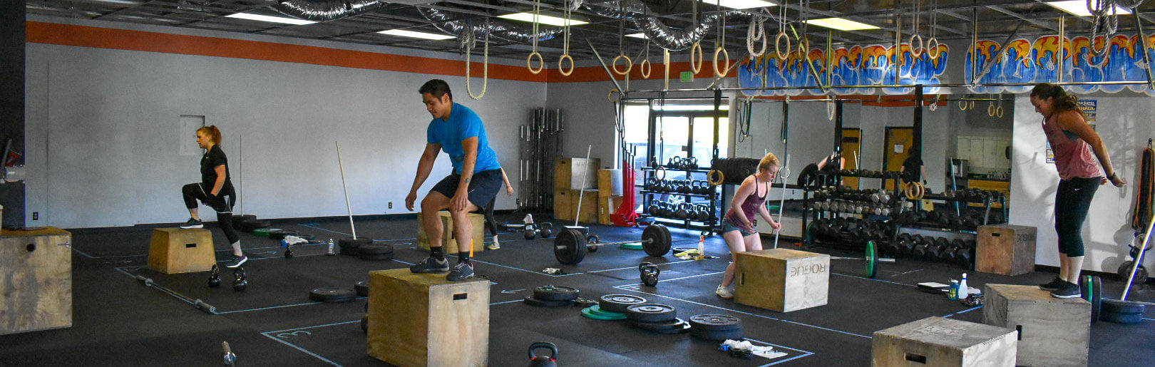 Class performs box jumps at CrossFit Alaska.