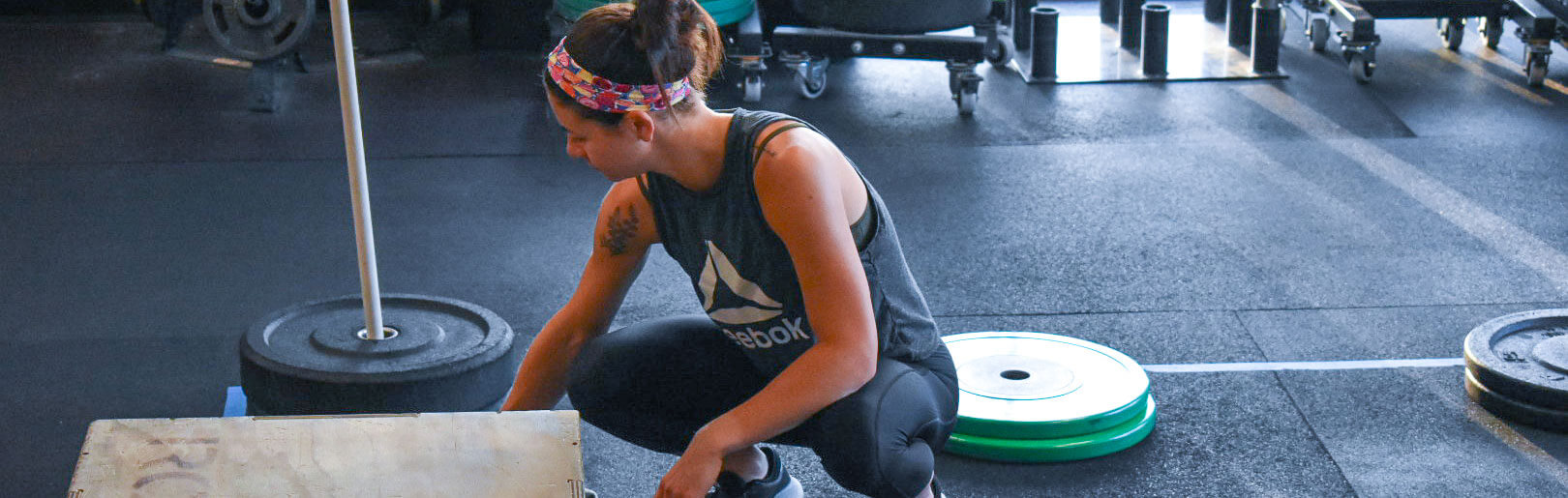 Member organizes her space at CrossFit Alaska.