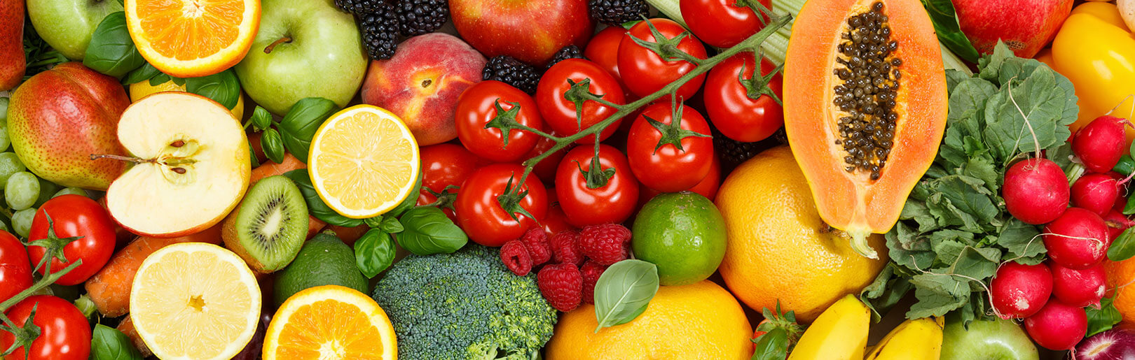 Colorful array of fruits and veggies recommended with nutritional coaching at CrossFit Alaska.